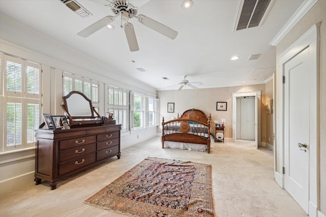 bedroom with crown molding, light colored carpet, visible vents, baseboards, and recessed lighting
