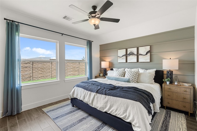 154 W Coralburst Loop, Montgomery, TX 77316 - bedroom featuring ceiling fan, baseboards, visible vents, and wood finished floors