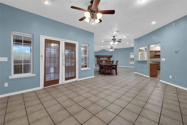 living area with a ceiling fan, baseboards, and recessed lighting