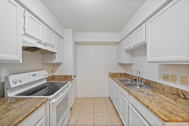 kitchen featuring under cabinet range hood, white appliances, a sink, and white cabinetry