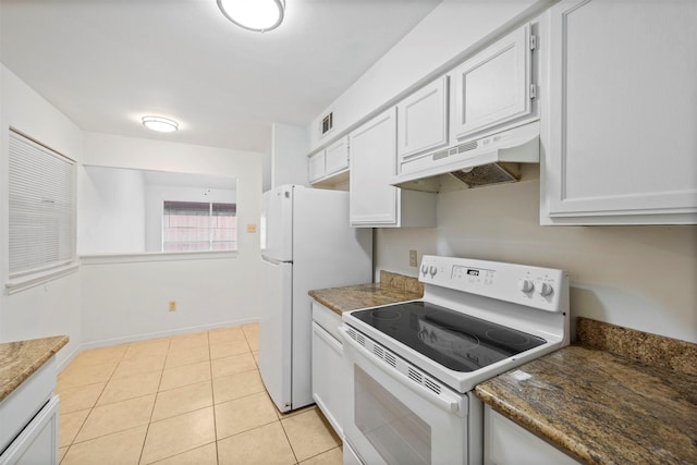 kitchen with under cabinet range hood, visible vents, light tile patterned floors, white appliances, and baseboards