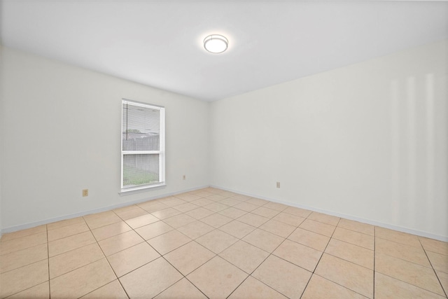 empty room with light tile patterned flooring