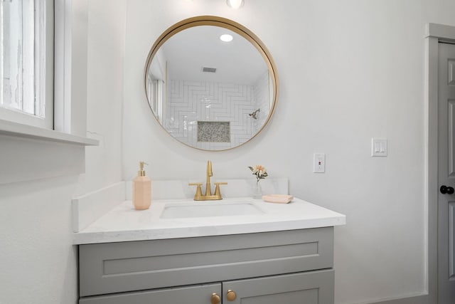 bathroom with visible vents and vanity