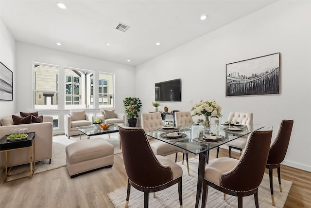 dining room featuring recessed lighting and wood finished floors