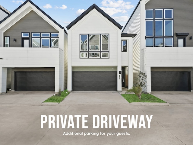 view of front of property featuring an attached garage and driveway