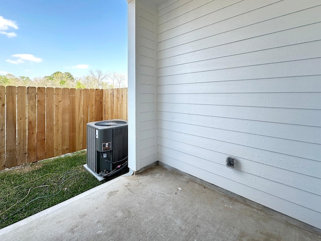 exterior details with central AC unit and fence