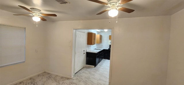 hall with marble finish floor, baseboards, and visible vents