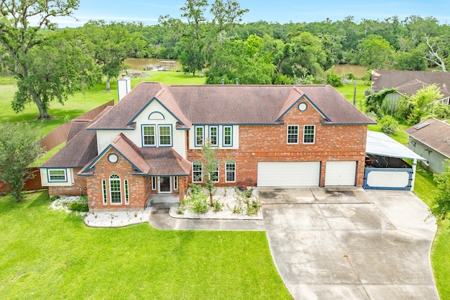 view of front of home featuring a chimney, driveway, roof with shingles, a front yard, and a garage