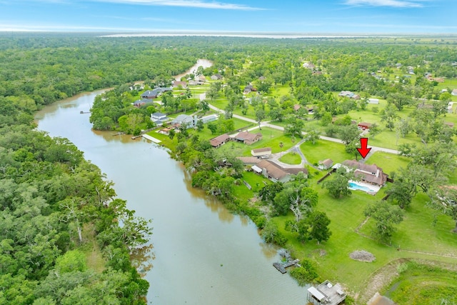 bird's eye view featuring a view of trees and a water view