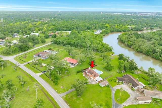 bird's eye view featuring a view of trees and a water view