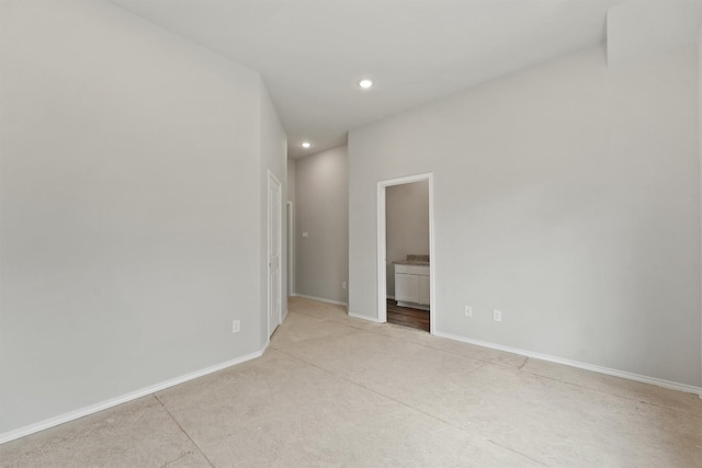 8685 Sassafras St, Willis, TX 77318 - empty room featuring baseboards, recessed lighting, and light colored carpet