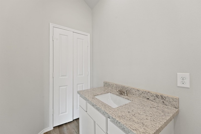 8685 Sassafras St, Willis, TX 77318 - bathroom with vanity and wood finished floors
