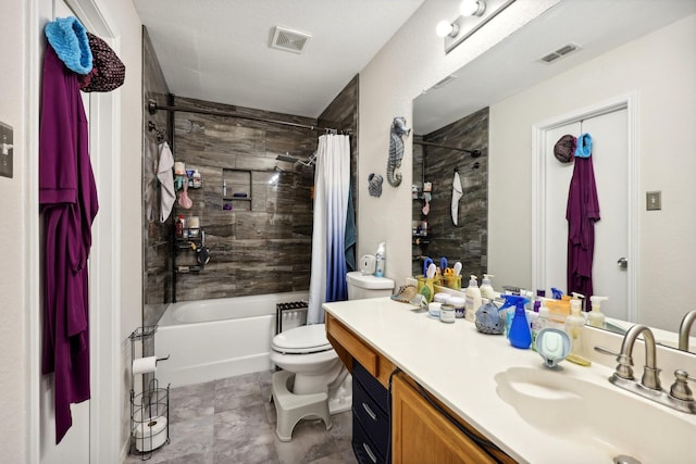 bathroom featuring visible vents, toilet, vanity, and shower / tub combo