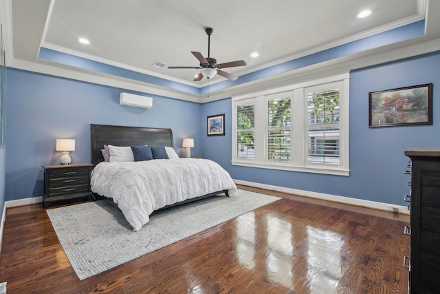 bedroom featuring a raised ceiling, visible vents, crown molding, and baseboards