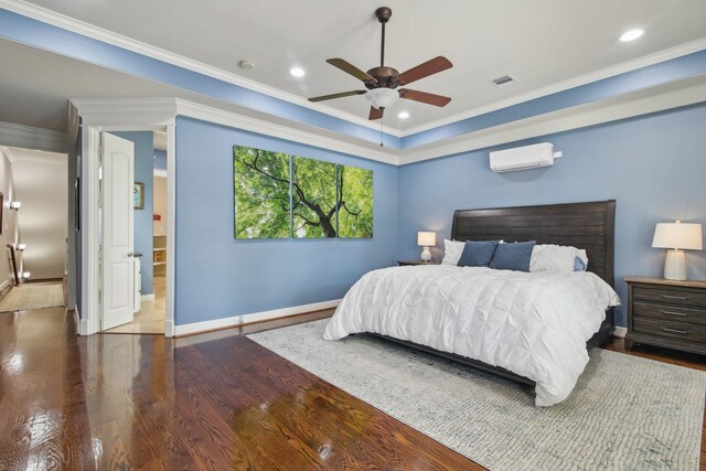 bedroom featuring crown molding, wood finished floors, a wall mounted AC, baseboards, and visible vents