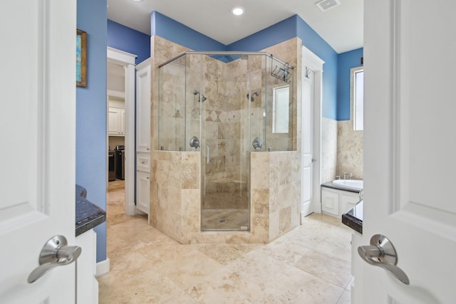 bathroom featuring visible vents and a stall shower