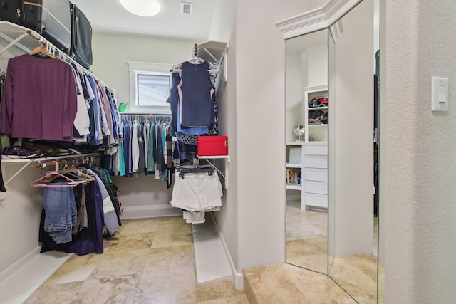 walk in closet with visible vents
