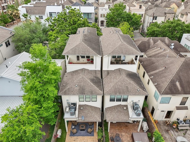 birds eye view of property with a residential view