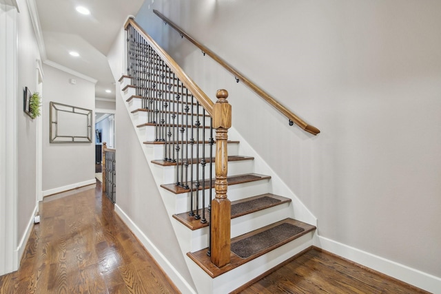 stairs featuring baseboards, ornamental molding, wood finished floors, and recessed lighting
