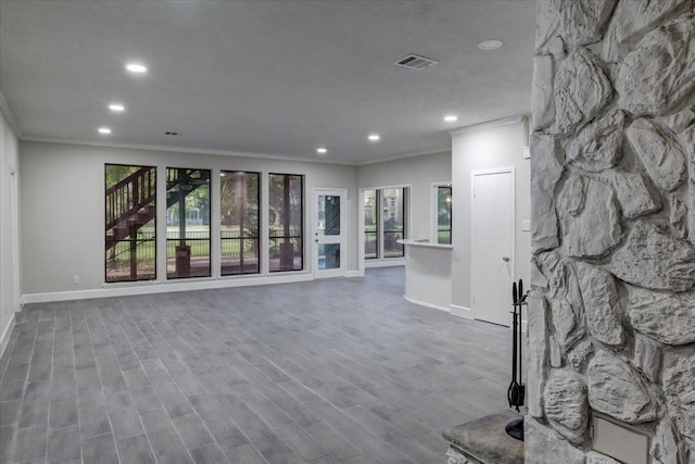 interior space with a wealth of natural light, recessed lighting, and ornamental molding