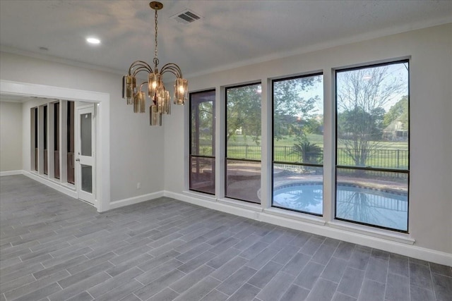interior space with baseboards, visible vents, and a healthy amount of sunlight