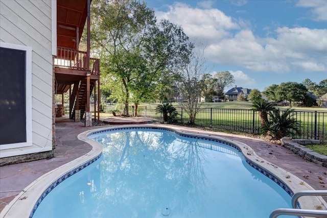 view of pool featuring a fenced backyard, a deck, stairs, and a fenced in pool