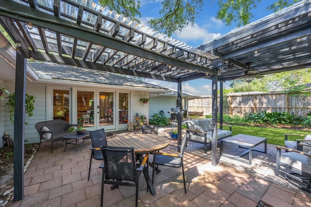 view of patio featuring outdoor lounge area, fence, a pergola, outdoor dining area, and french doors