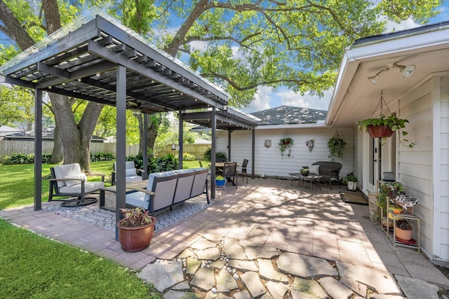 view of patio / terrace with fence, a pergola, and an outdoor hangout area