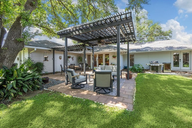 back of house featuring a pergola, outdoor lounge area, a shingled roof, a yard, and a patio