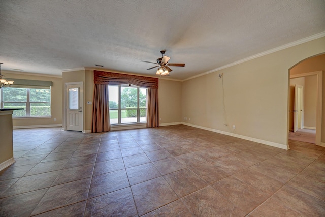 tiled empty room with ceiling fan with notable chandelier, arched walkways, ornamental molding, and a healthy amount of sunlight