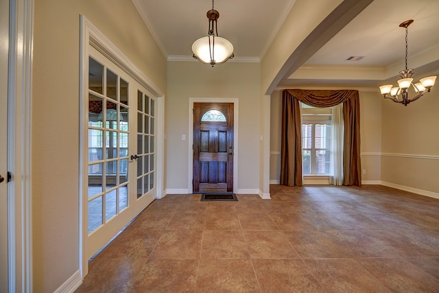 324 Howard St, Sealy, TX 77474 - foyer featuring ornamental molding, a chandelier, and baseboards