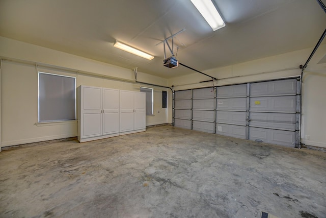 garage featuring a garage door opener