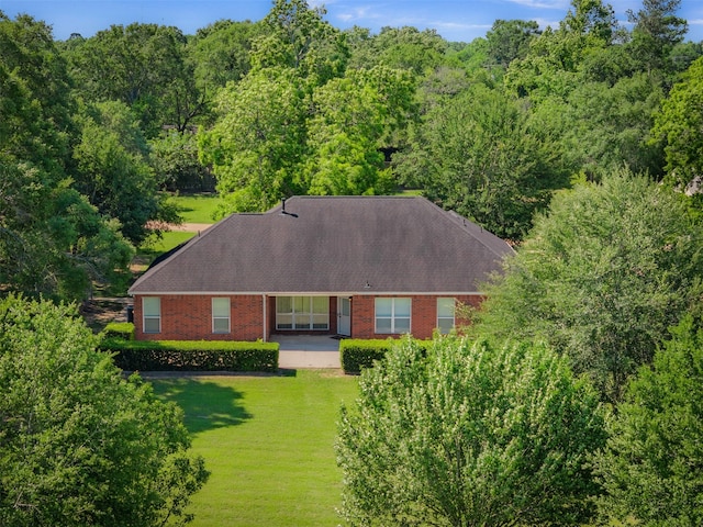 324 Howard St, Sealy, TX 77474 - view from above of property with a forest