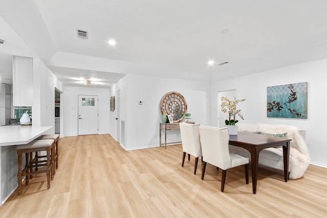 dining room featuring recessed lighting, baseboards, visible vents, and light wood-type flooring