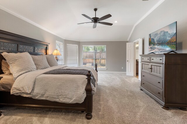 bedroom featuring a ceiling fan, vaulted ceiling, baseboards, ornamental molding, and light carpet