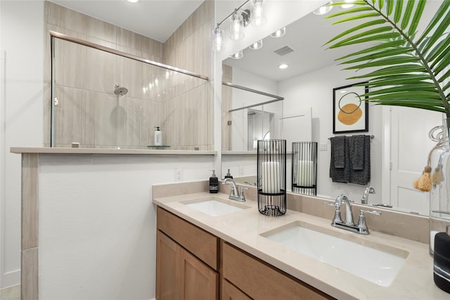 158 W Coralburst Loop, Montgomery, TX 77316 - full bathroom featuring visible vents, a sink, a shower, and double vanity