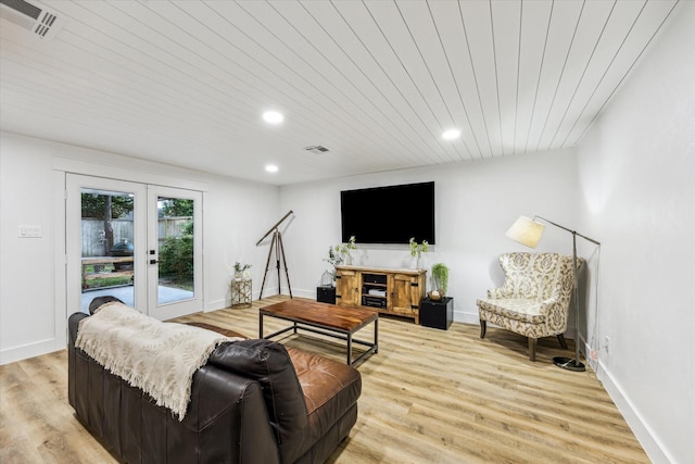 living room with french doors, visible vents, recessed lighting, and light wood-style floors