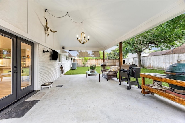 view of patio with central AC, a fenced backyard, french doors, and a grill