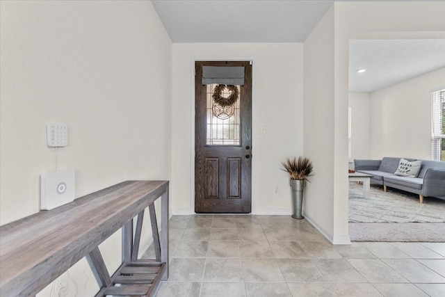 8804 Ute Creek Ln, Magnolia, TX 77354 - foyer entrance with light tile patterned flooring and baseboards