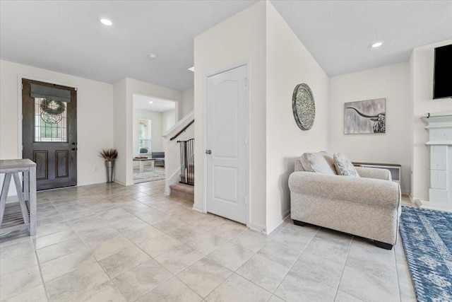 8804 Ute Creek Ln, Magnolia, TX 77354 - foyer entrance featuring baseboards, stairway, light tile patterned flooring, and recessed lighting