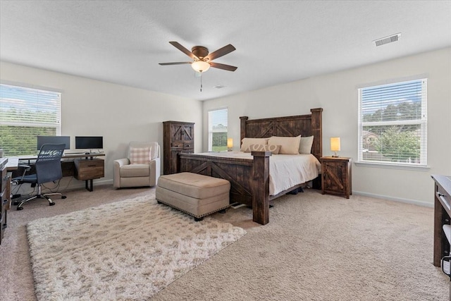8804 Ute Creek Ln, Magnolia, TX 77354 - bedroom featuring light colored carpet, visible vents, ceiling fan, and baseboards