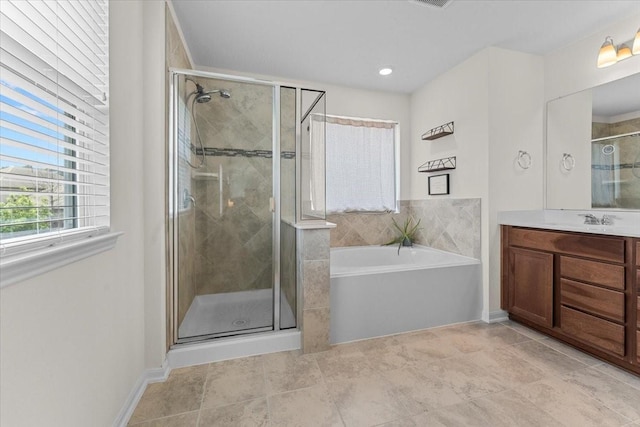 8804 Ute Creek Ln, Magnolia, TX 77354 - full bathroom featuring vanity, a shower stall, and a garden tub
