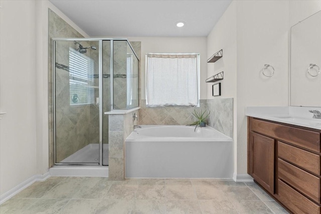 8804 Ute Creek Ln, Magnolia, TX 77354 - full bath featuring tile patterned floors, a shower stall, a bath, vanity, and baseboards
