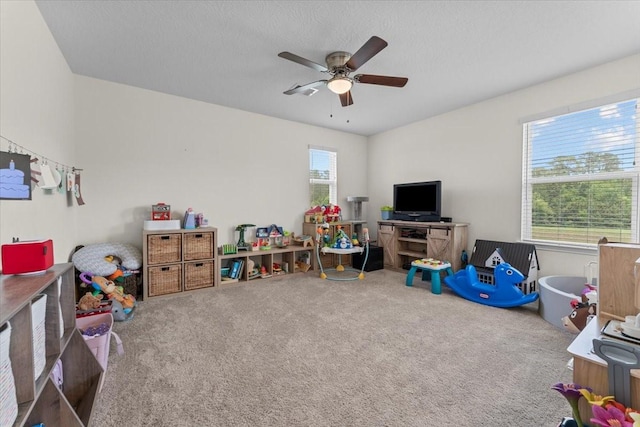 8804 Ute Creek Ln, Magnolia, TX 77354 - recreation room featuring a ceiling fan and carpet floors