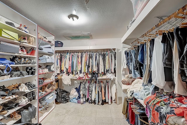 walk in closet featuring tile patterned floors and visible vents