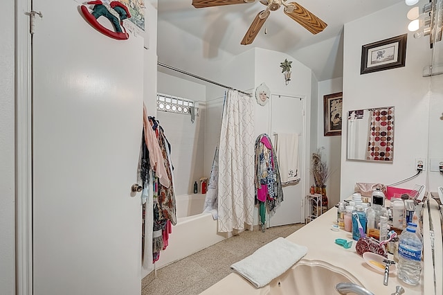 bathroom featuring a ceiling fan, vanity, and shower / bath combination with curtain