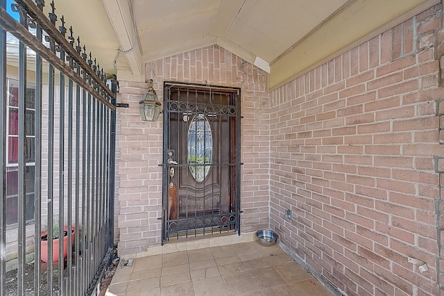 entrance to property with brick siding