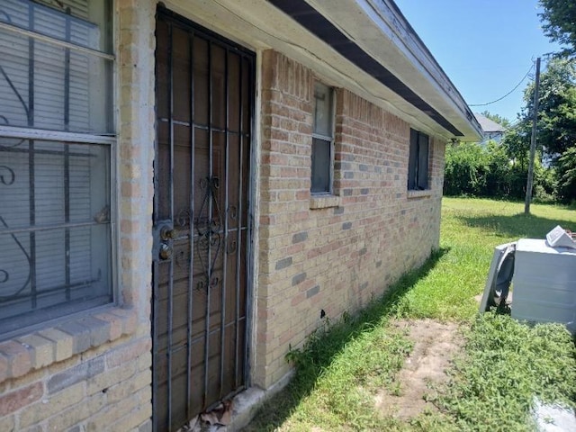 2602 Dalview St, Houston, TX 77091 - view of side of home with brick siding and a lawn