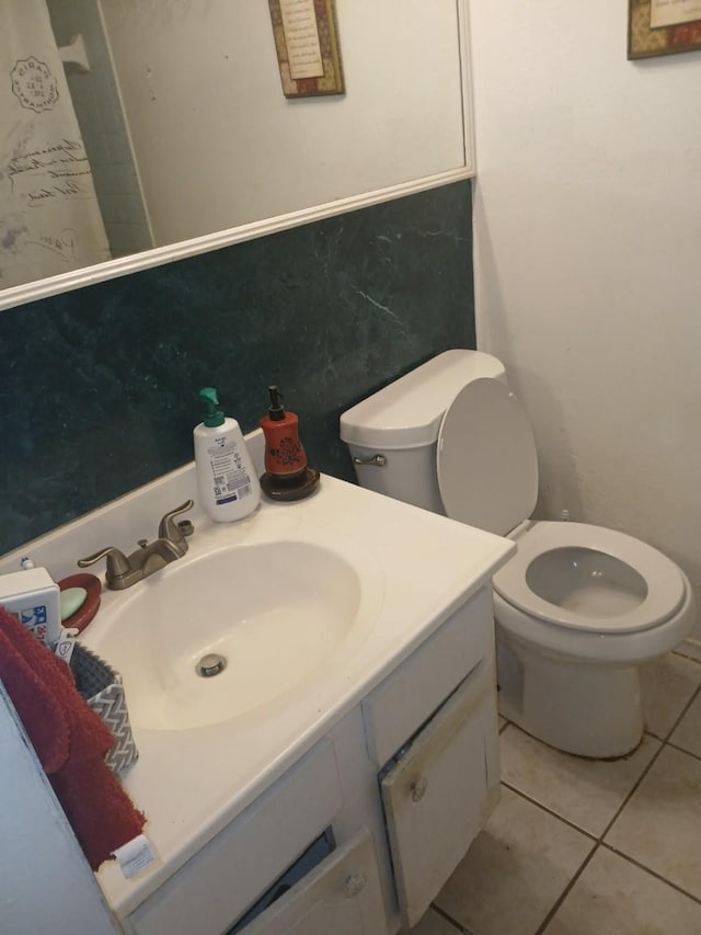 2602 Dalview St, Houston, TX 77091 - bathroom with vanity, toilet, and tile patterned floors
