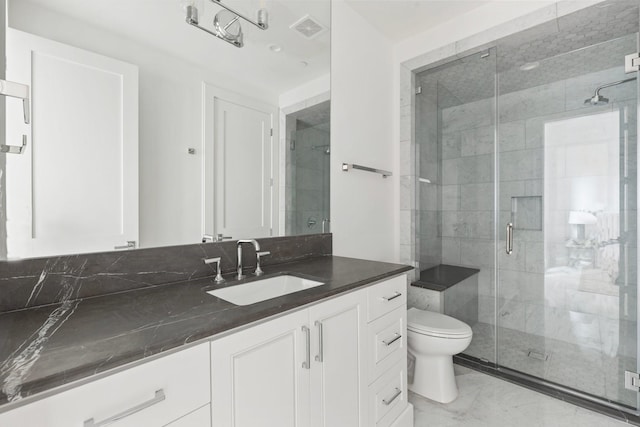 full bathroom with a shower stall, vanity, marble finish floor, toilet, and visible vents